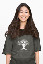 Load image into Gallery viewer, Young girl wearing a large charcoal coloured t-shirt which says What would David do? and depicts a beautiful tree image
